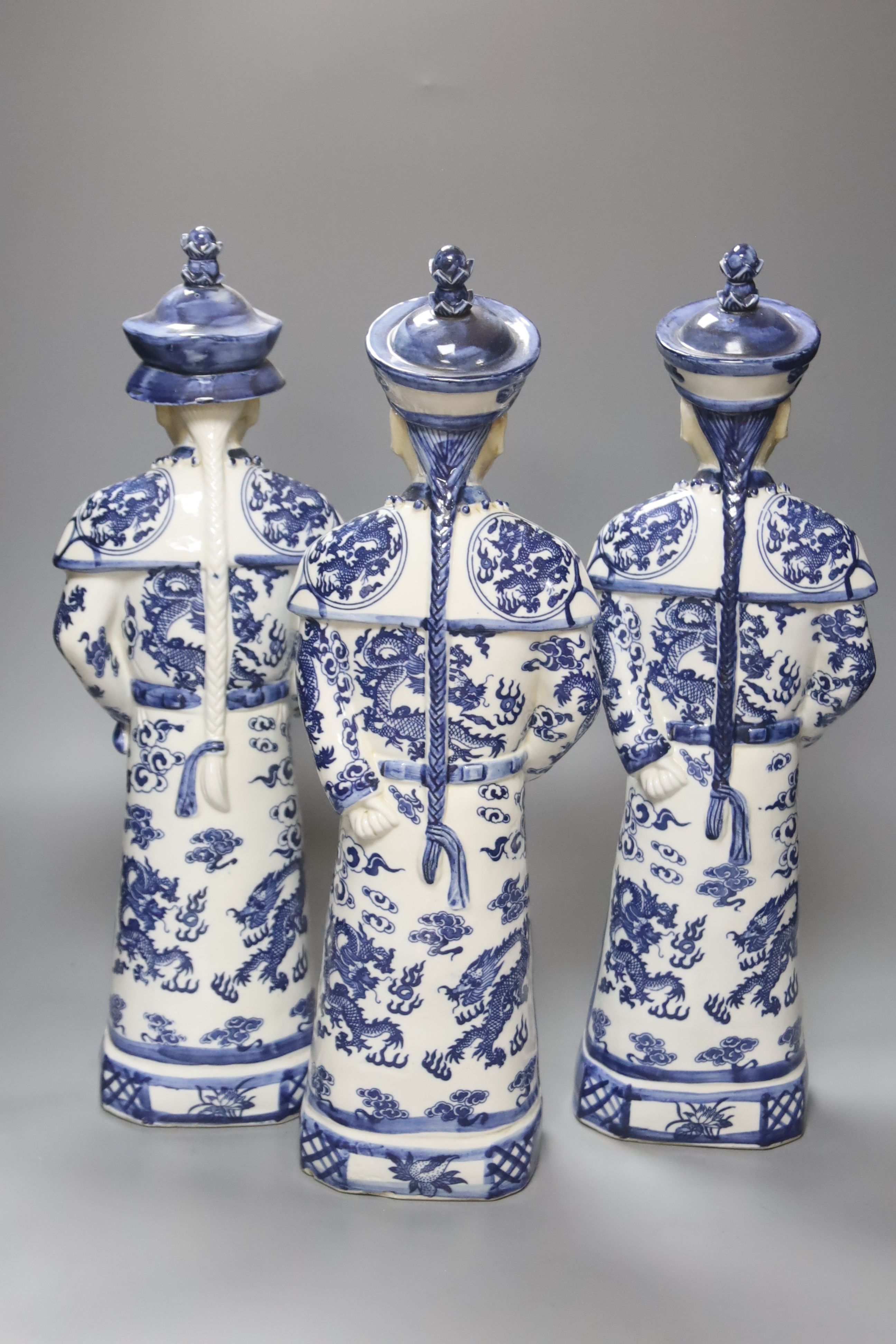 A trio of large Chinese blue and white figures, impressed seal marks to undersides, height 45cm